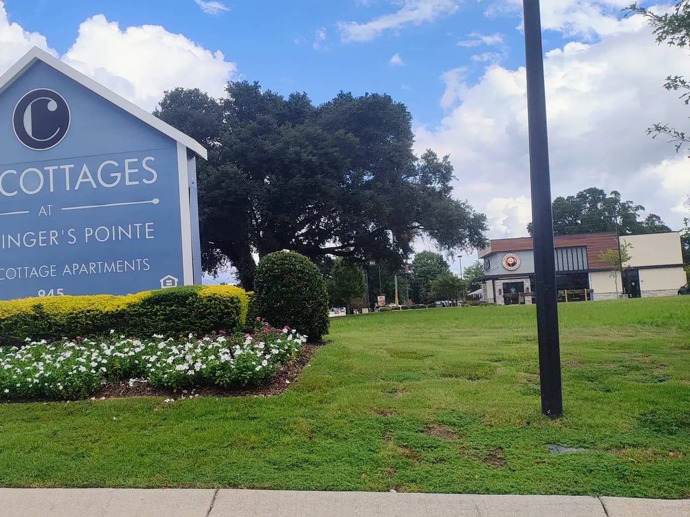 The Cottages at Schillinger's Pointe entrance sign at 945 Schillinger Road South