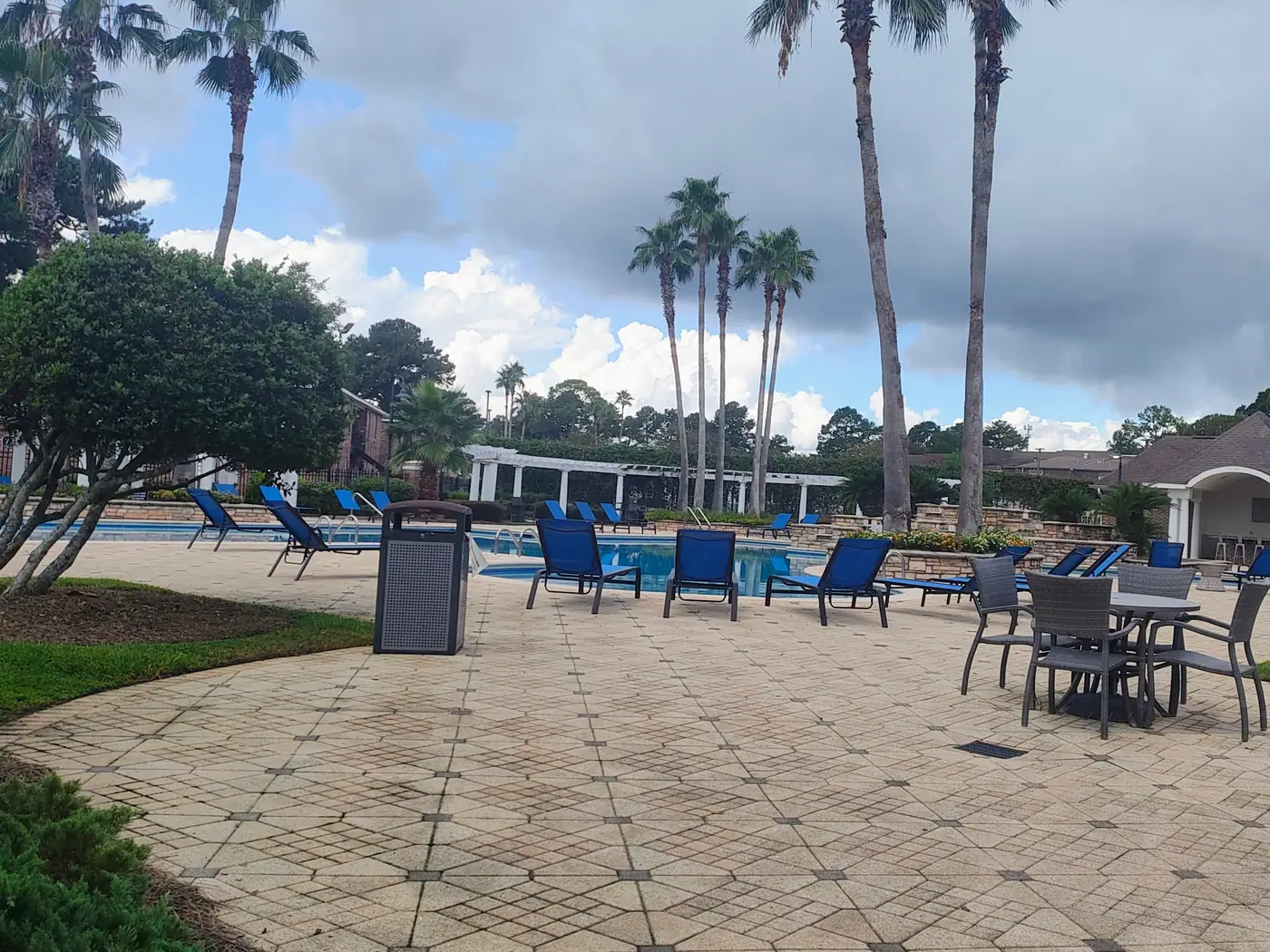Palm-lined resort pool at The Estates at Lafayette Square