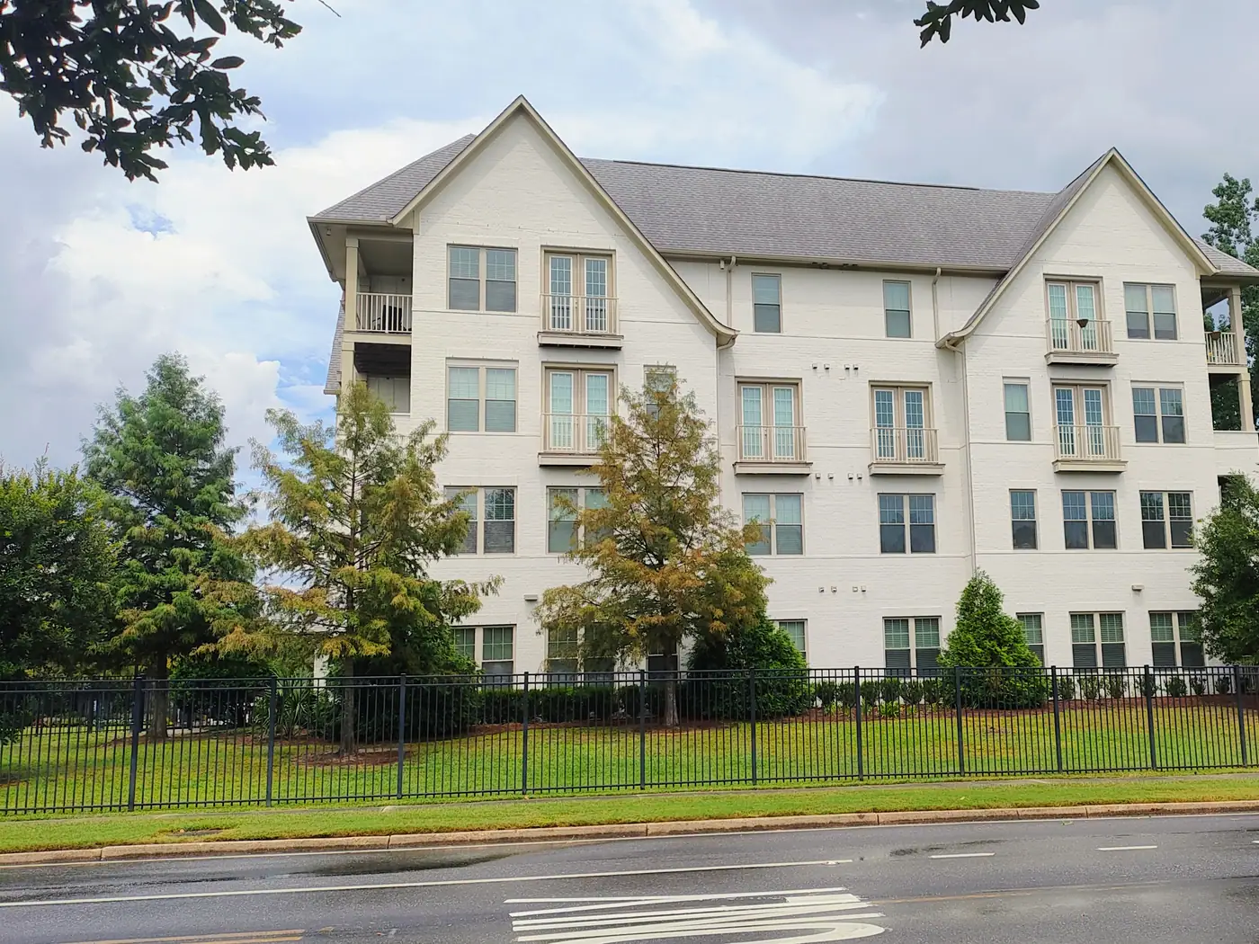 Residences behind the iron fence at Highland at Springhill