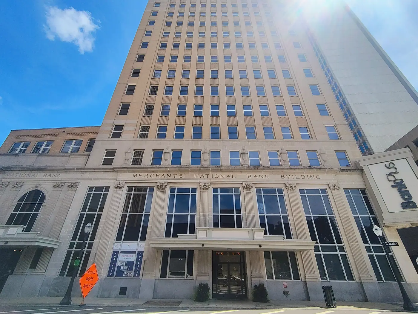 The Merchants Plaza tower rising over downtown Mobile