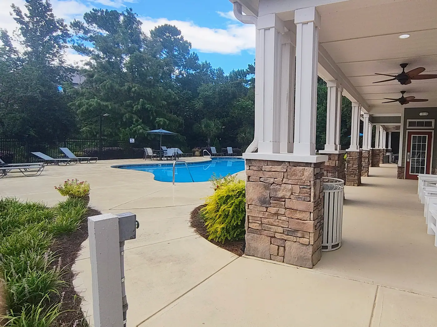 Covered walkway beside the pool at The Crossings at Cottage Hill