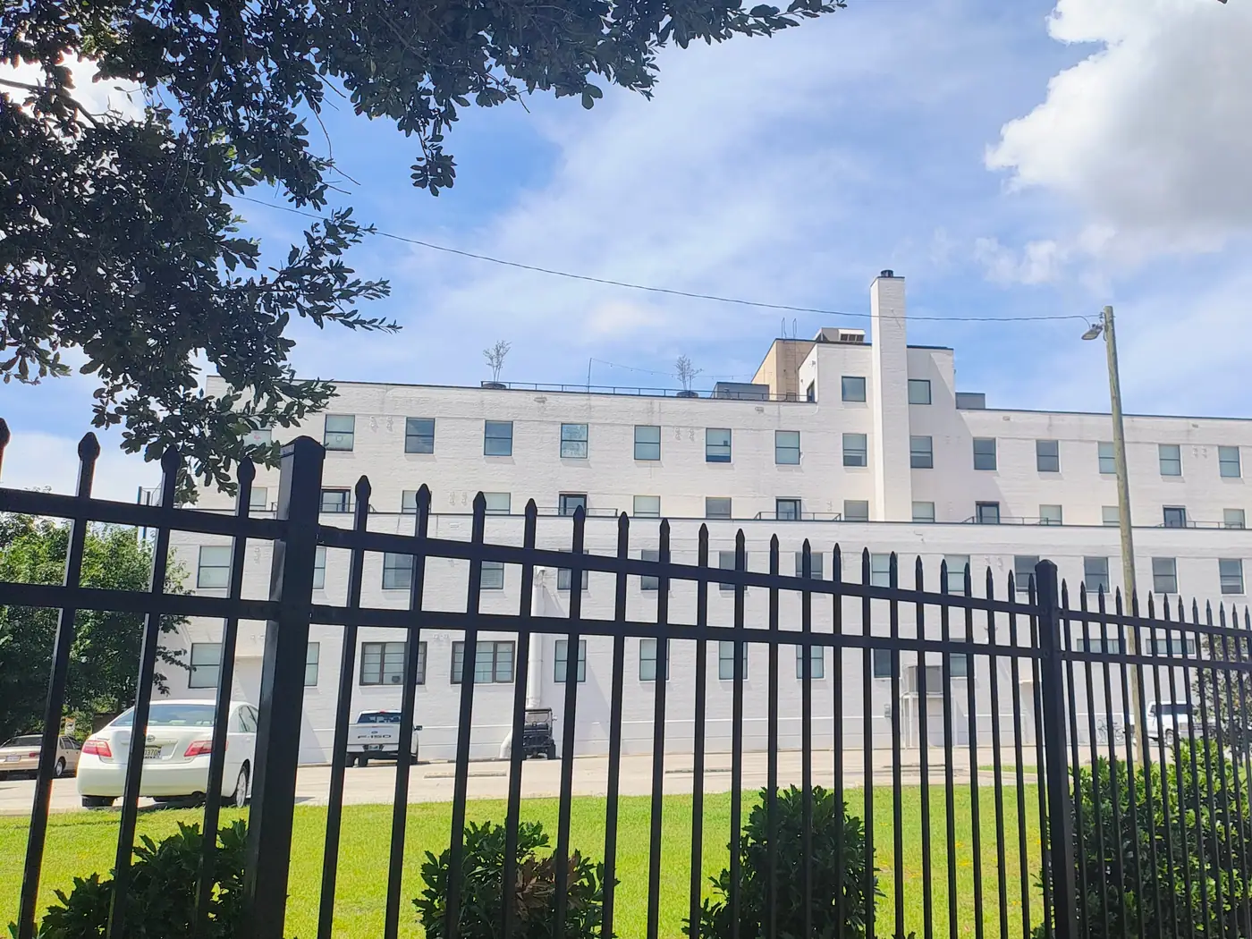 The Gateway building behind its iron perimeter fence