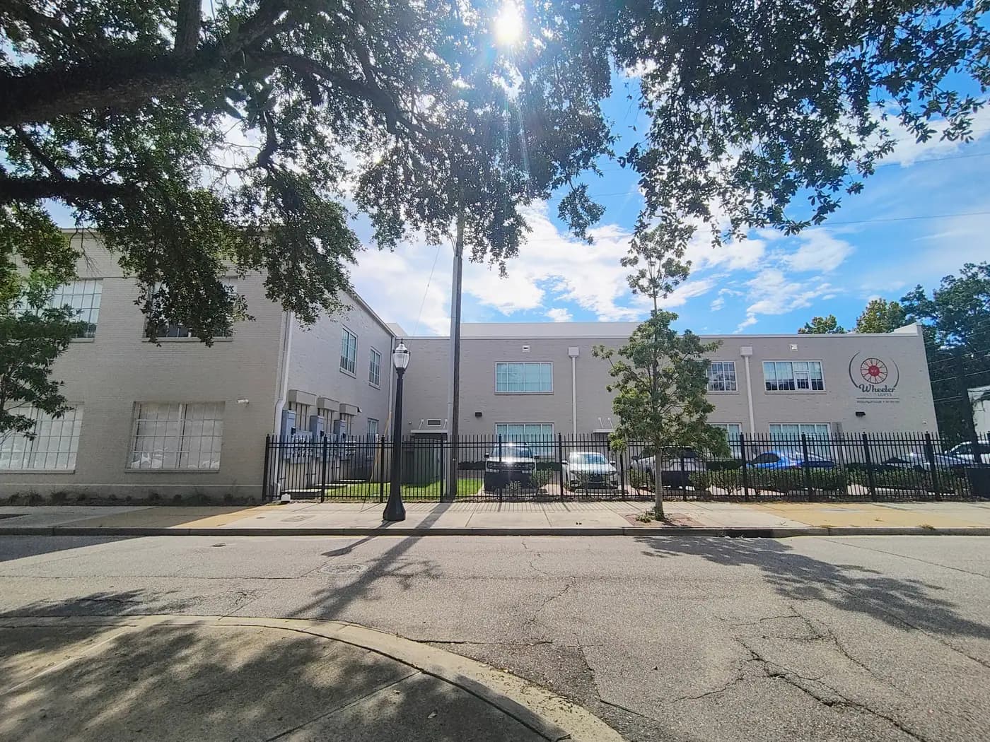 The Wheeler Lofts along a live oak-lined street in downtown Mobile