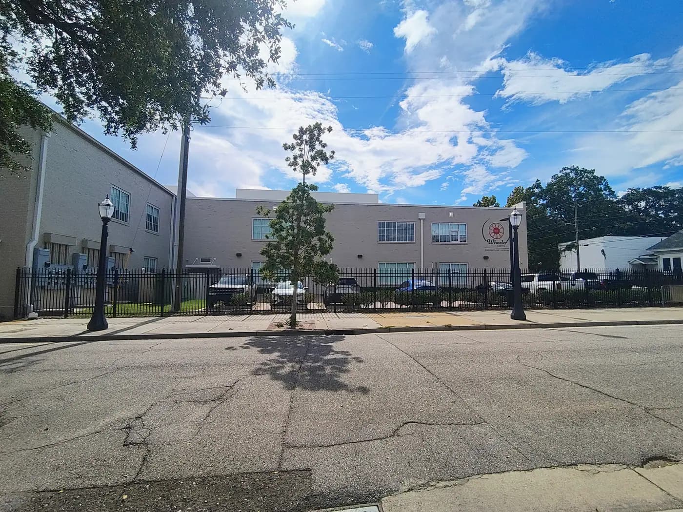 Gated parking and sidewalk at The Wheeler Lofts